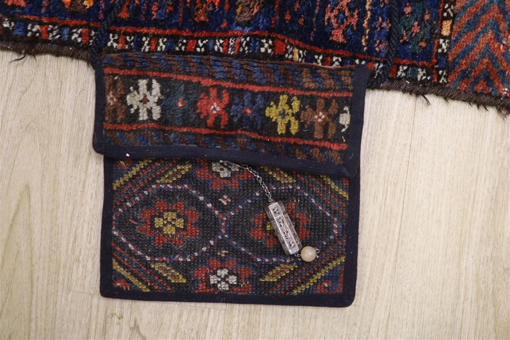 A Turkoman saddle rug, 104 x 82cm and a small carpet bag